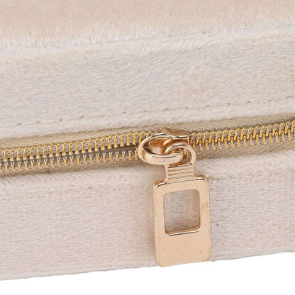 Beige jewelry case for travel with a gold zipper, perfect for organizing accessories on the go