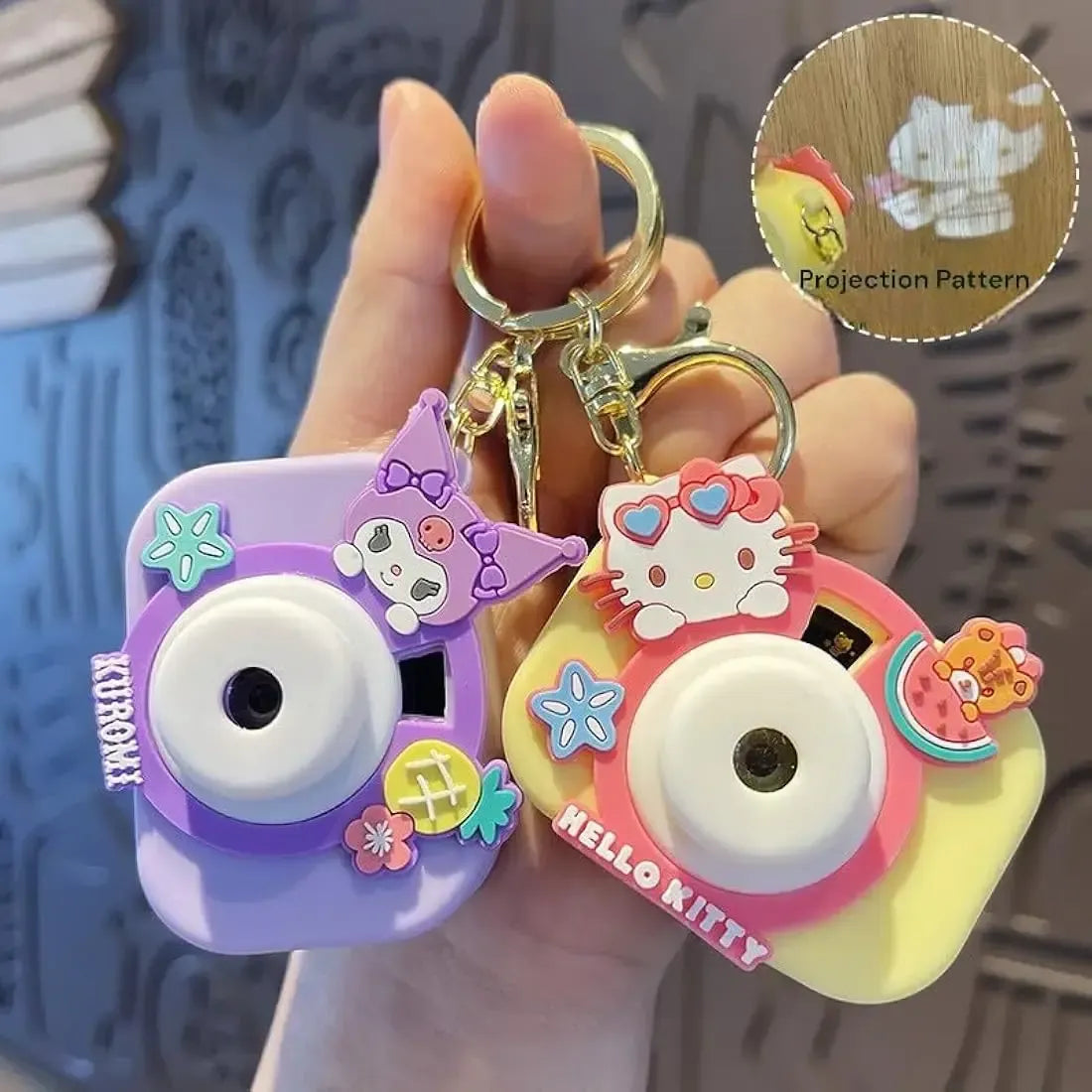 Colorful Kodak camera keychain in purple and yellow, perfect for ages 3+, great as a return gift