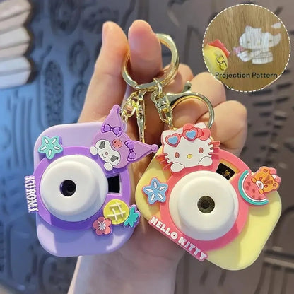 Colorful Kodak camera keychain in purple and yellow, perfect for ages 3+, great as a return gift