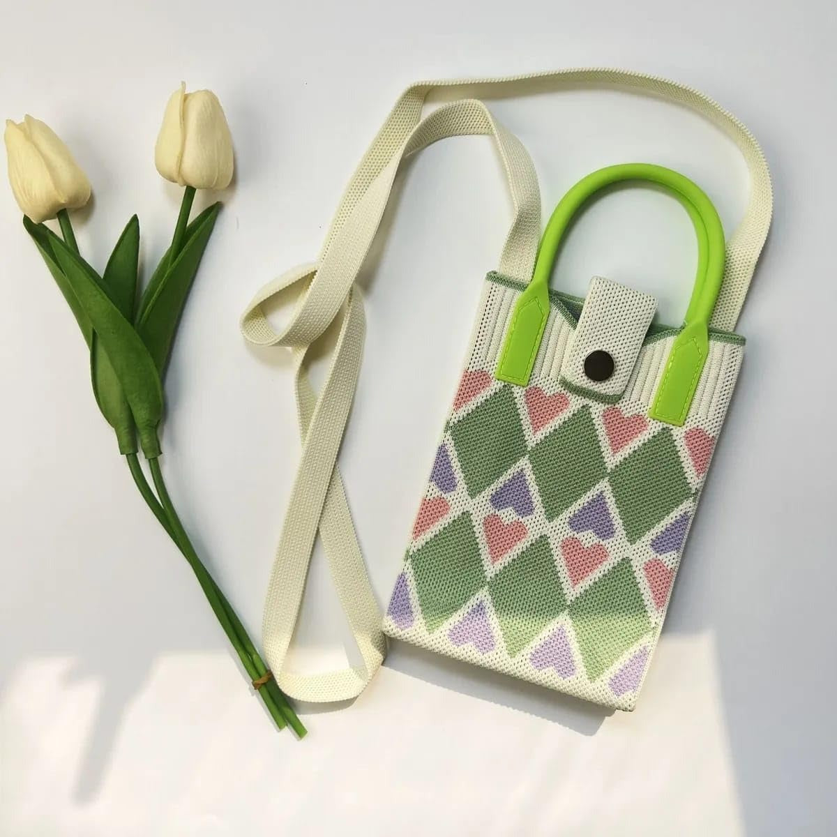 Colorful NIYO TOYS sling bag with heart patterns, perfect for kids and stylish outings, features a leather crossbody mini bag