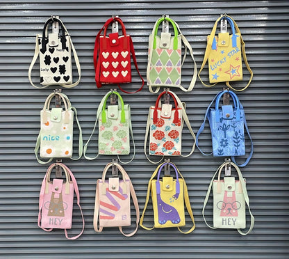 Colorful collection of NIYO TOYS leather crossbody mini bags for kids, featuring various playful designs