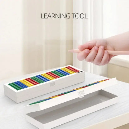 Lego-themed pencil box in white with colorful building bricks, ideal for ages 5+, perfect for school supplies