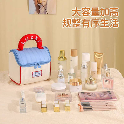 NIYO TOYS Jelly Bag in cream and blue with a red lucky handle, perfect for ages 3+, ideal for storing beauty products