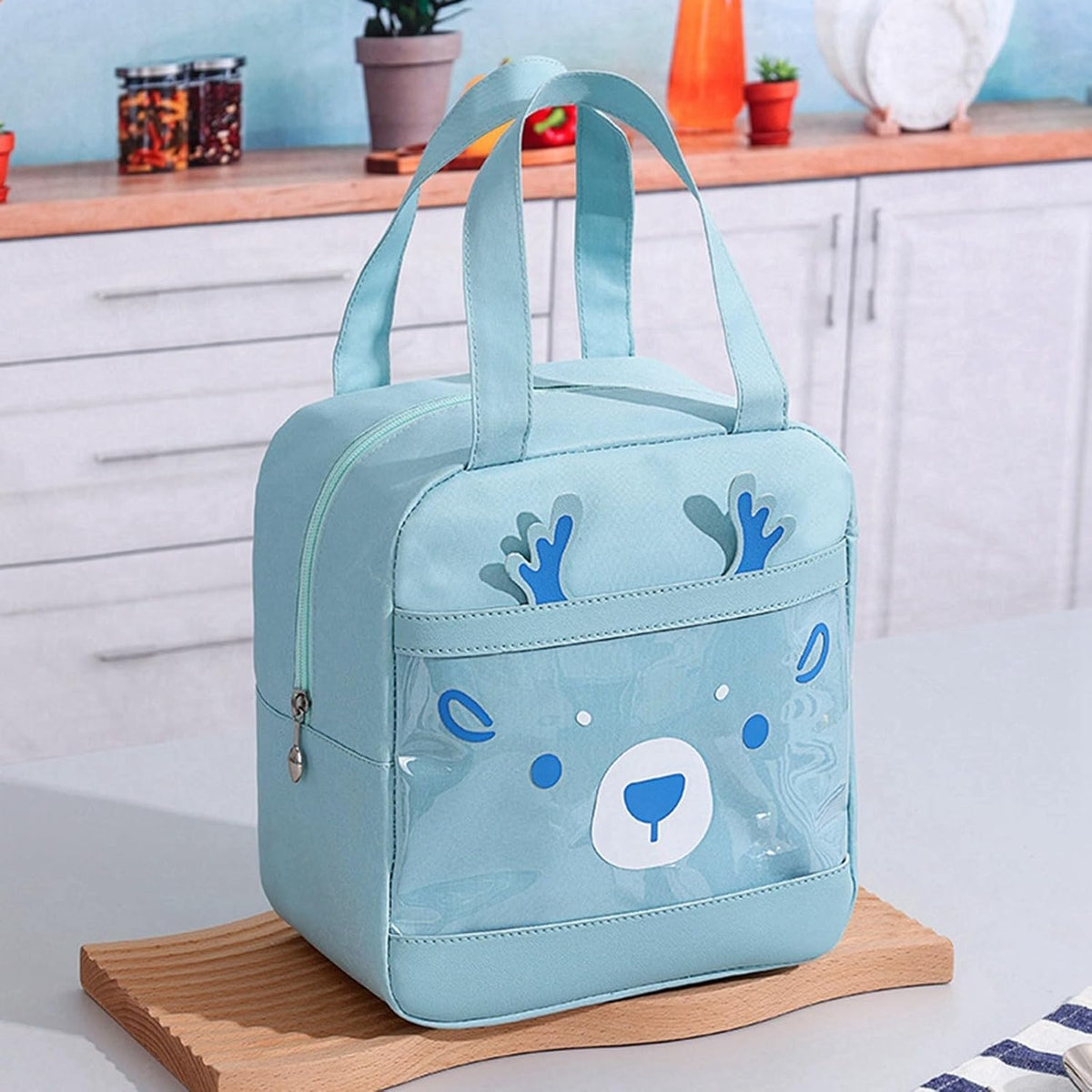 Light blue lunch insulated bag for kids featuring a cute bear design, perfect for school or picnics
