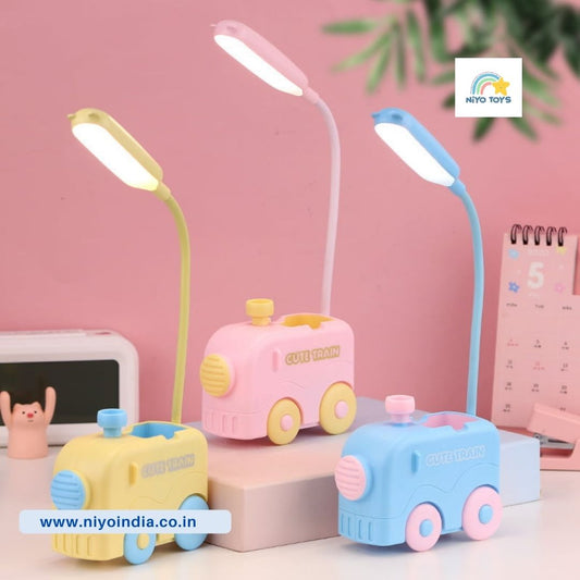 Colorful kids train table lamp in pink and blue for playful bedroom decor