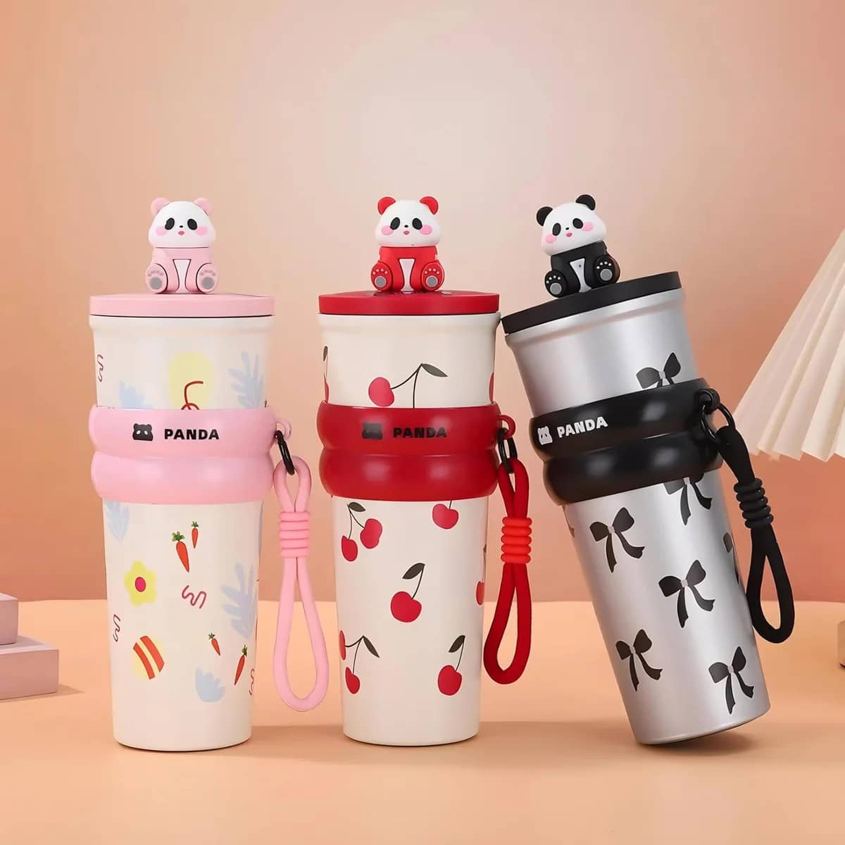 Owala black cherry water bottle in three colorful panda designs, perfect for kids aged 3 and up