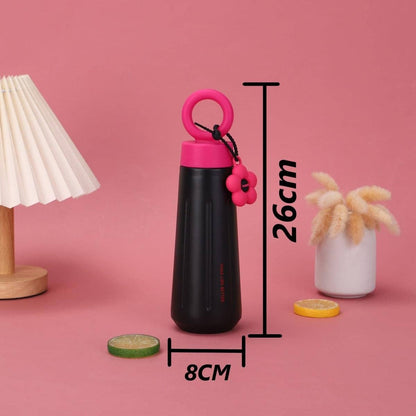 Owala water bottle in black with pink cap and flower charm, perfect for kids and adults on the go
