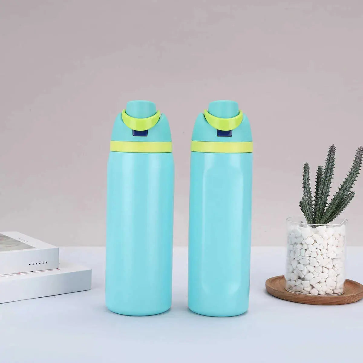 Light blue Owala water bottle with yellow lid, perfect for all ages and hydration on the go
