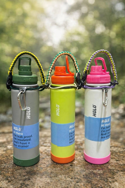 Three colorful Owala water bottles for kids, age 5+, leak-proof design with built-in strainer