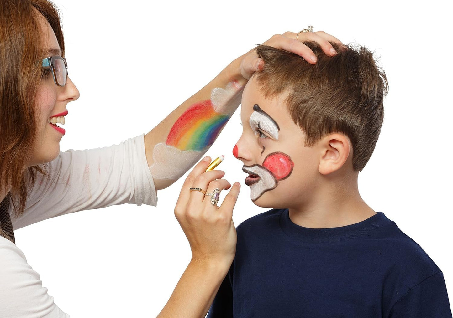 NIYO TOYS Marker Pens in use for face painting a clown design and rainbow on a child