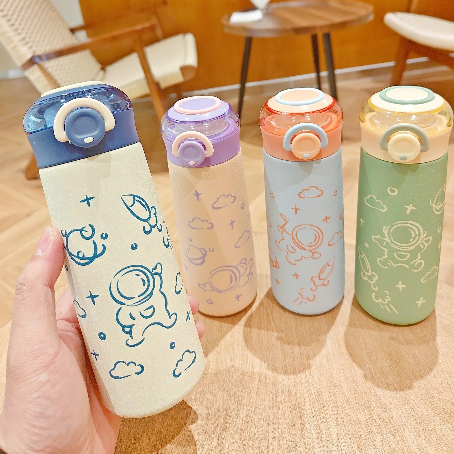 NIYO TOYS astronaut-themed sippers in various colors for kids with secure twist caps