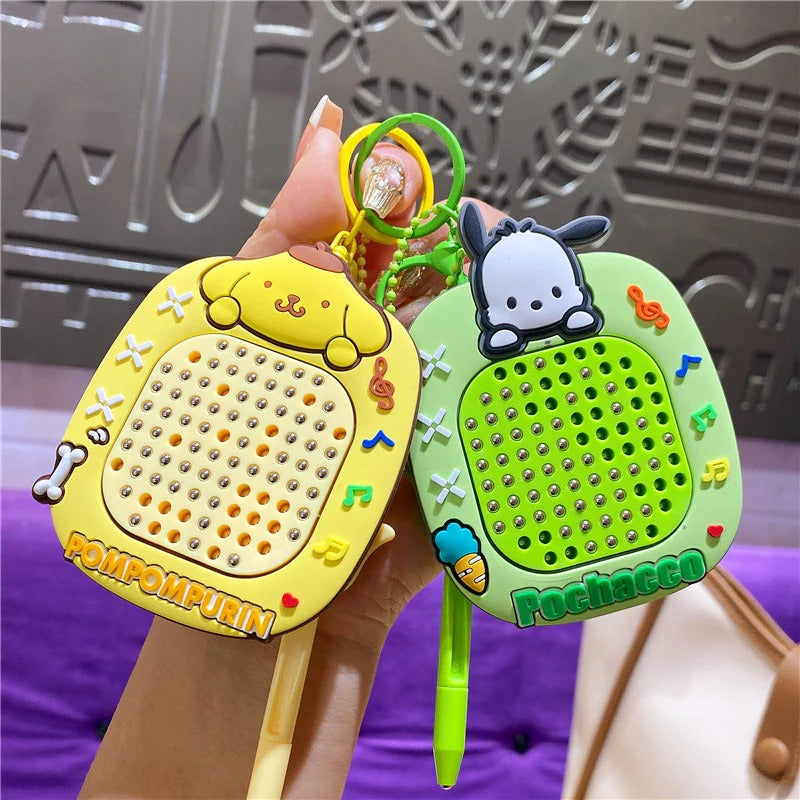 Colorful keychain speakers featuring Pompompurin and Pochacco, age 3+, perfect as return gifts