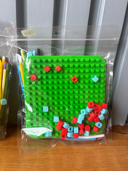 Green sensory fidget toy puzzle set with colorful building blocks, age 3+, great for developing fine motor skills