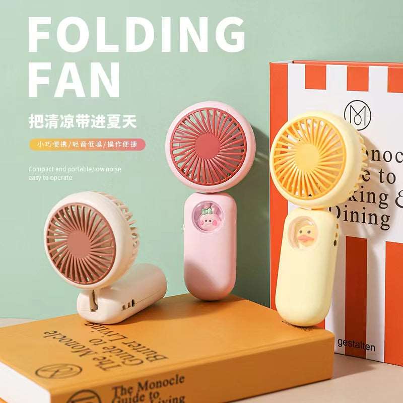 Colorful small fan in pink and yellow, ideal for kids age 3+, perfect for summer cooling