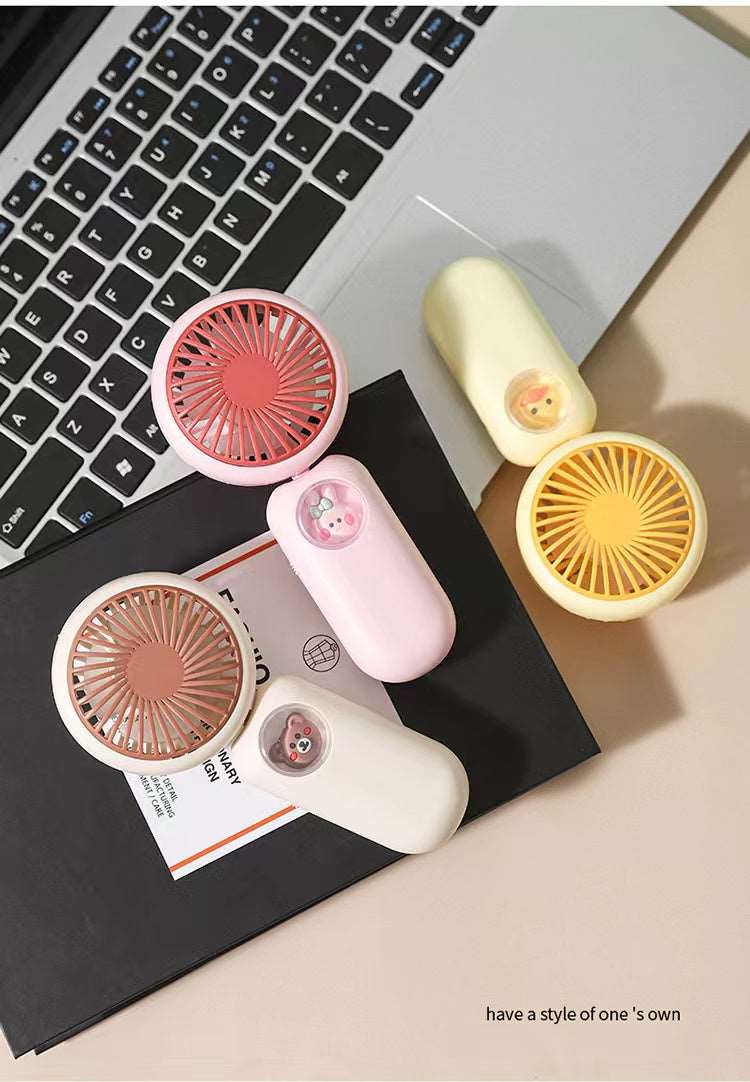 Colorful small fan collection in pink, yellow, and cream, perfect for ages 5 and up, great for warm days