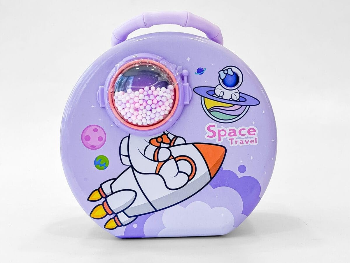 Purple space piggy bank with rocket design, perfect for ages 3+, encourages saving in a fun way