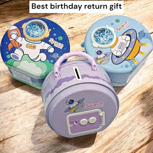 Colorful space piggy bank set for kids ages 3 and up, featuring an astronaut and UFO design
