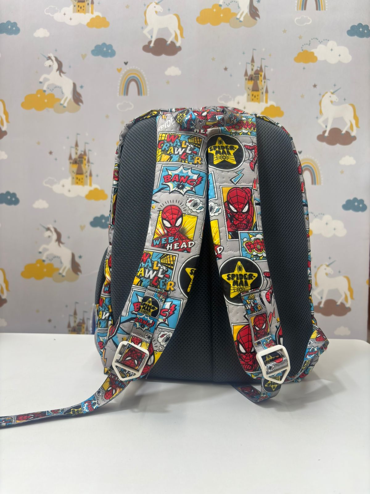 Spider Man backpack in gray with colorful comic designs, perfect for kids age 3 and up
