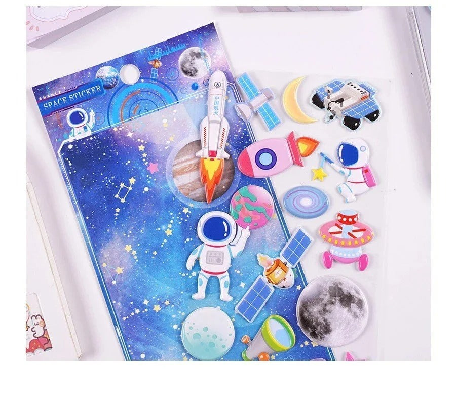 Decorative stickers of space featuring rockets, astronauts, and planets, ideal for ages 3 and up