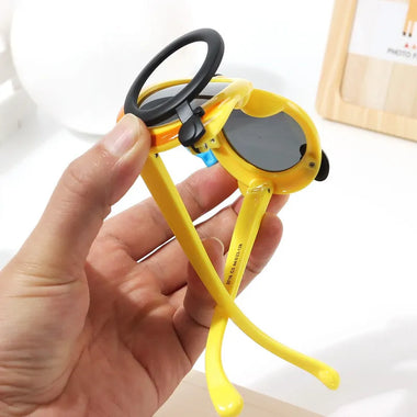 NIYO TOYS stylish sunglasses for children in yellow with playful design and round lenses