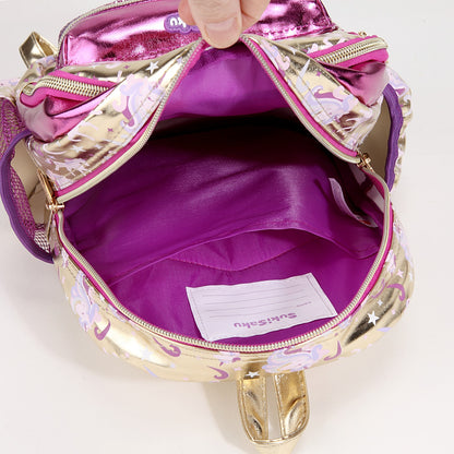 Open golden unicorn backpack with pink interior, perfect for ages 3+ for school or play