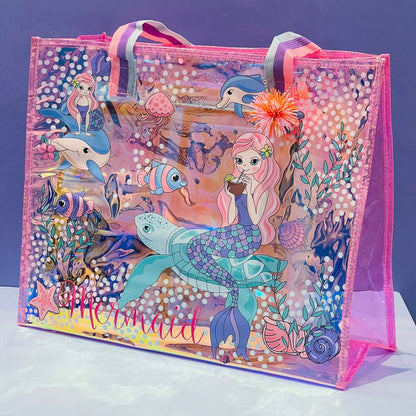 Mermaid-themed tote bag in pink and clear, perfect for kids ages 3+, ideal for beach trips and storage