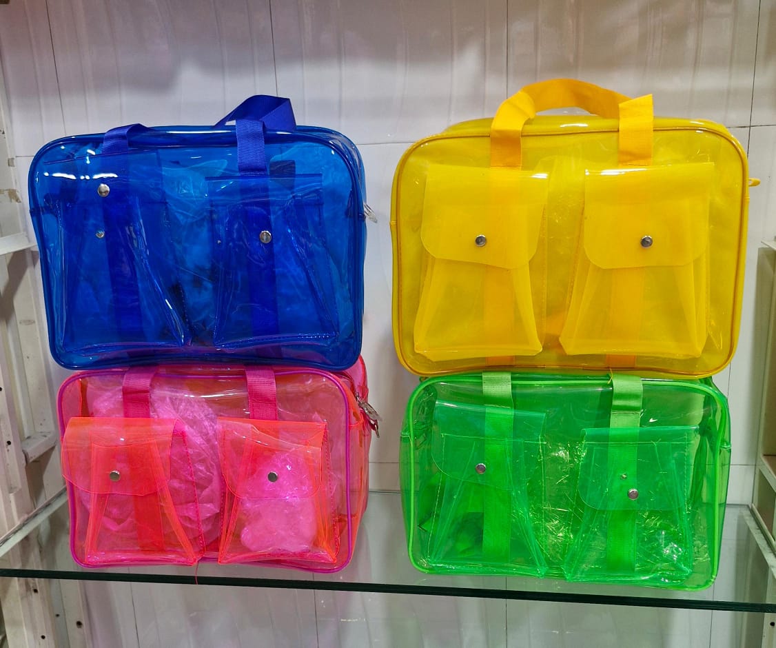 Colorful transparent neon tote bags in blue, yellow, pink, and green with two front pockets