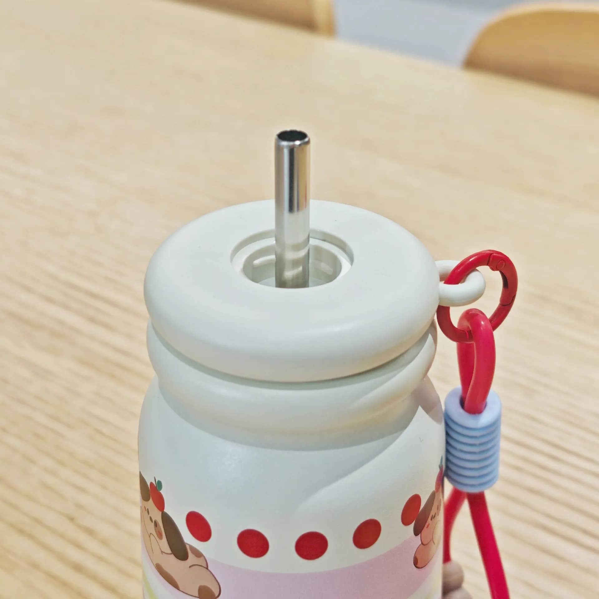 White stainless steel drinks bottle with a straw, designed for kids age 3+, ideal for on-the-go hydration